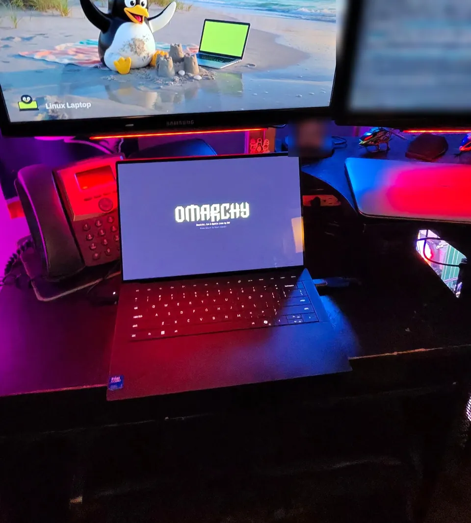 XPS 14 on the bench with the Omarchy installer running
